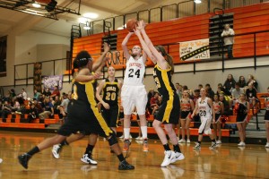 Maddie Down shoots and scores over three Hudson's Bay defenders Monday, at Washougal High School. The senior netted 12 of her 19 points in the second half to help the Panthers beat the Eagles 55-51.