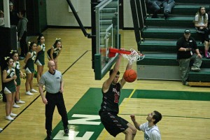 Trevor Jasinsky dunks an alley-oop from Camas teammate Jake Hansel Dec. 16, at Evergreen High School. The Papermaker boys beat the Plainsmen 93-85.