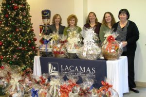 Lacamas Community Credit Union recently donated 35 holiday dinner baskets to its members as part of its Community Partnership program. Pictured left to right are Lacamas President/CEO Kathleen Romane, Eve Rossmiller, Terri Dostert, Hillery Losli and Tracy Thomas.