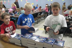 The Camas-Washougal Rotary Club delivered nearly 700 dictionaries to third-graders in Camas and Washougal in December. Here, students at Gause Elementary School look through their new dictionaries.