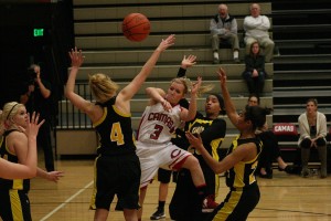 Camas High School senior McKenna Jackson tricks three defenders and passes the ball to an open teammate. The Papermakers beat the Eagles 60-19 Thursday, in the Camas warehouse.