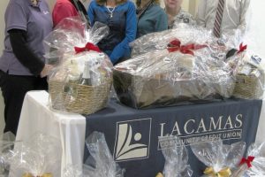 Lacamas Community Credit Union recently donated 20 holiday dinner baskets to its members as part of the 2011 Community Partnership program. Pictured above (left to right) are Rhonda Evans, Sherri Smith, President/CEO Kathleen Romane, Eve Rossmiller, Sharon Collins and Tim Lapsley.