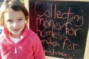 Lilly Drasin, 7, spent the afternoon of Sunday, Dec. 4, collecting money for local homeless families. By the end of the day, she had raised $52. She and her dad, David Drasin, donated the money to the Salvation Army of Camas-Washougal.