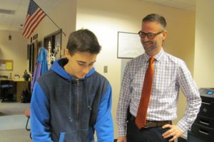 Aaron Smith, principal at Skyridge Middle School, was recently named the St. Helen's Region Distinguished Principal of the Year. Here, he chats with eighth-grader Grant Heiser.