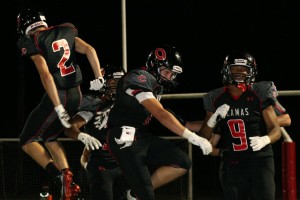 Dane Santos celebrates with his teammates after returning an interception for a 45-yard touchdown. The Camas High School football team defeated defending 4A state champion Chiawana 16-14 Friday, at Doc Harris Stadium.