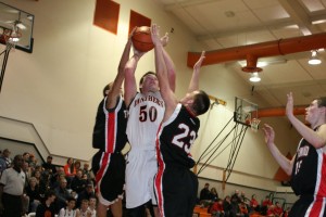 Two Tenino defenders are unable to stop Isaac Bischoff from making a basket Wednesday, at Washougal High School. The Panthers rallied from 10 points down at halftime to win their seventh straight game to start the season.