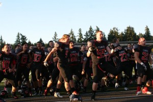 The Camas High School football players complete their pre-game "Haka" dance Friday, at Doc Harris Stadium.