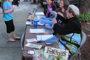 Kitty Hibbs, Jamie Morin and Carol Alice (left to right) explained to First Friday visitors how tickets are obtained by visiting participating businesses in downtown Camas. The tickets can then be entered to win prizes from merchants. Hibbs, Morin and Alice are volunteers with the Downtown Camas Association. 