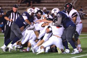 Several Papermakers pile on top of the ball handler for the Riverhawks Friday, at Edgar Brown Memorial Stadium in Pasco. Camas gained a 28-0 advantage at halftime, before finishing off Chiawana 35-14.