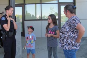 Patrol officer Katie Endresen chats with attendees during the Girl Cops are Awesome event. "I would have absolutely loved to have something like this when I was younger," she said. 