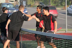 Camas' Andrew Lee and Anish Prasad (right) shake hands with Washougal's Christian Rambousek and Santiago Altieri after a two-and-a-half hour tennis match in 90-degree heat Friday, at Washougal High School. Lee and Prasad won 4-6, 7-6 (7-4), 6-4.