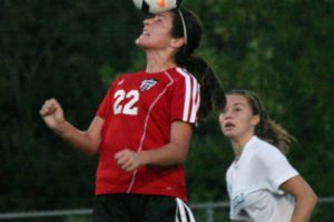 Alyssa Tomasini strikes the soccer ball with her head during a game at Ridgefield High School, Sept. 5. She scored two goals for Camas Saturday, in a 7-1 victory at Enumclaw. She had two assists Thursday, when Camas beat Columbia River 7-1.