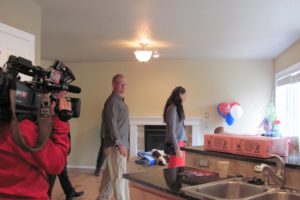 The Collins family inspects the kitchen in their newly remodeled Washougal residence. It is the sixth home donated to an injured veteran though a partnership between U.S. Bank, Feedom Alliance and Five Brothers.                                