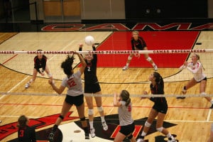 Anna Roche stuffs the volleyball at the net for the Papermakers Thursday, at Camas High School. Camas beat Union 25-20, 25-13, 25-14.