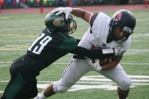 Jordan Del Moral keeps moving forward for the Camas football team Friday, at McKenzie Stadium. He rushed for 113 yards and scored three touchdowns to help the Papermakers beat Evergreen 62-21.