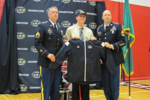 Isaac Hodapp receives hsi honorary marching band jacket during a ceremony at Camas High School Oct. 13. Hodapp, a senior, as selected to participate in the U.S. Army All-American Marching Band. Selected by the National Association for Music Education in cooperation with All American Games and Drum Corps International, the band features the 125 top marching band members from across the United States. 