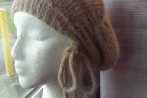 An alpaca rouched hat, designed and created by Danielle Lee, is among the crocheted items available to purchase at Rain City Electrolysis & Boutique. Lee offers private and group lessons in knitting, crochet and needle felting.