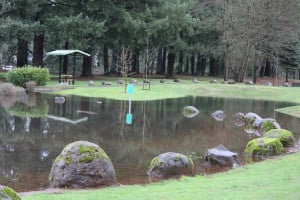 A portion of the parking lot and pathway at Heritage Park in Camas was flooded Monday, following several inches of heavy rain. The National Weather Service has issues flood watch warnings for Tuesday and Wednesday.