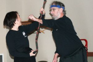 Harumi Morota uses a walking cane to block an attack by assistant instructor Terry King during an Advanced Tai-Chi and Organized Cane Defense class taught by John Paul Jones at the Lacamas Lake Lodge.