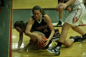 Courtney Clemmer takes the basketball away from a Union Titan Friday, at Union High School. Clemmer scored a tiebreaking basket in the fourth quarter, and then grabbed a key defensive rebound in the final seconds, to help the Papermakers earn a 27-25 victory.