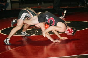 Sam Malychewski puts the squeeze on his opponent from Battle Ground Wednesday, at Camas High School. The Papermakers defeated the Tigers 45-21.