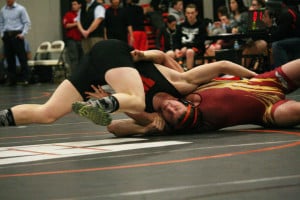 Taylor Leifsen rolls on top of his opponent from Prairie during a double-duel Dec. 15, at Washougal High School. Leifsen won both of his matches by pinfall. Washougal lost to Prairie on a tiebreaker before beating Fort Vancouver 60-18.