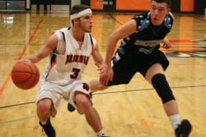 Daniel Davis (left) ignites the offense for the Washougal boys basketball team against Hockinson Monday. The high school senior also helped the Panthers beat Woodland in overtime Friday by stealing the ball and draining a 3-pointer at the buzzer. "It was my favorite game I've played in my four years here," Davis said. (Dan Trujillo/Post-Record)