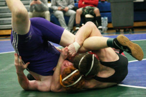 Sam Malychewski (right) locks up another victory for the Camas wrestling team. The sophomore captured the 170-pound Clark County championship Saturday. (Dan Trujillo/Post-Record)