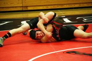 Washougal High School senior Taylor Leifsen pinned an R.A. Long Lumberjack Thursday. The Panthers won 48-29 to secure their third league wrestling title in the last four years.