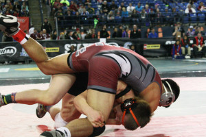 Taylor Leifsen tosses Toppenish's Saul Godina during his medal match at the 2A state wrestling tournament Saturday, in the Tacoma Dome. Leifsen won 10-2 to earn seventh place at 152 pounds.