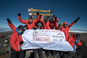 Camas resident Julie Ryan (center, back row) and twin sister Jana Cannon celebrate reaching the summit of Mount Kilimanjaro with their group from the Multiple Myeloma Research Foundation. "It was such an exhilarating experience," Ryan said. "It exceeded my expectations in every way."