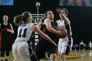 Alyssa Blankenship runs by two Anacortes Seahawks and scores two points Friday, at the Yakima Sun Dome. She scored 1,241 points in four years of high school basketball in Washougal, which is second all-time in the program's history. Blankenship was also named to the 2A all-state tournament team. 