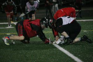 Camas Lacrosse Club players Elijah Manfredi (left) and Caleb Wynn (right) face off during practice Friday. Camas hosts Rex Putnam tonight at Cardon Field, behind the high school. The junior varsity game starts at 6 p.m., followed by the varsity game at 8 p.m. 