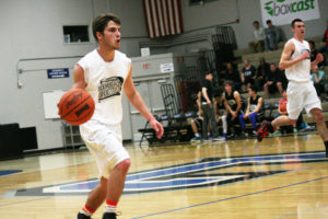 Daniel Davis (left) scored 10 points and Matt Murphy (right) added six points and eight rebounds to help the South stars beat the North 90-83 in the Les Schwab Roundball Shootout Sunday, at Clark College.