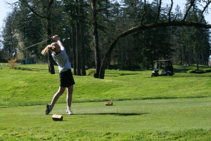 Elise Filuk tees off on the 10th hole at Camas Meadows March 29. The Papermakers shot a school record best 9-hole round of 148 to beat Union by 22 strokes. Filuk finished at even par. (Dan Trujillo/Post-Record)