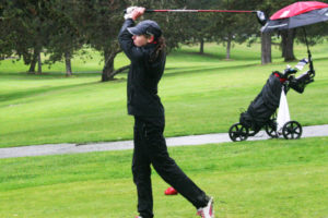 Hailey Oster crushes her last drive of the day at the Chieftain Invitational Thursday. The Camas High School sophomore shot a 78 on the par-72 Lewis River Golf Course, in Woodland, to win the 68-player tournament. 