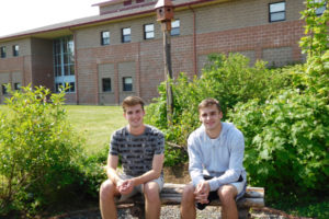 CHS students Seth Bradshaw (left) and Adam Ryan collaborated on their Eagle Scout projects to create benches, birdhouses and arbors, all made from reclaimed wood, in the garden at Skyridge Middle School. 