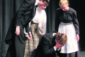 Townspeople Sean Finucane, Emily McNeale and Brittyn Slocum surround Victor Frankenstein,  played by Tristan Fackler. He wrote an original script of the popular novel, which will be performed the next two weekends at Washougal High School's Washburn auditorium. 