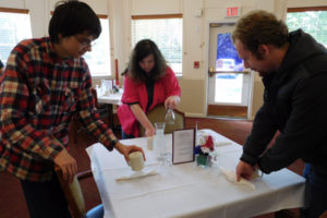 Pathways students, from left, Nova Delp, Beverly Carlson and Michael Neketuk prepare a table for lunch service at Columbia Ridge Senior Living. 