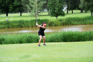 Kallie Sakamoto bends her driver and smashes the golf ball on the 18th hole Wednesday, at the Mint Valley Golf Course in Longview.