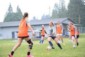 Hannah Taie looks for a Nemesis teammate to pass to during Thursday's practice at H.B. Fuller Park, in Salmon Creek. The U-17 Oregon State Cup champions will compete in the U.S. Youth Soccer Regional June 20 to 25, in Boise, Idaho. 