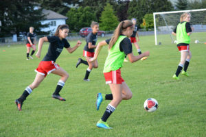 LuLu Sadler moves the soccer ball up the field for the Washington Timbers U-14 Red girls during Wednesday's practice at the Harmony Sports Complex. The U-14 Oregon State Cup champions will compete in the U.S. Youth Soccer Regional Monday through Saturday, June 20 to 25, in Boise, Idaho.