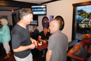 Wayne Havrelly (left) mingled with patrons of Smeads Pub, in between his June 30 musical performances. They included Brian Shold (right). Shold was in the same first grade class as Havrelly's mother, Sandy. Havrelly, a former news anchor and investigative reporter for KGW-TV, in Portland, now enjoys singing and voice-over work. He is available to perform classic rock, folk and country music at birthday parties, class reunions and other events.