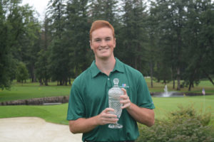 Brian Humphreys holds his second place trophy from the Oregon Amateur Championship. The 18-year-old golfer from Washougal won five match play contests in three days.