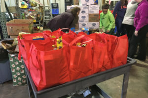 Volunteers organize food for a weekend backpack program for local students, at the Inter-Faith Treasure House. Donations will be accepted for the hunger relief effort at the "Pirates in the Plaza" event Saturday, at Reflection Plaza in downtown Washougal. (Contributed by Inter-Faith Treasure House)