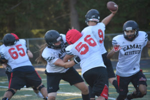 Dakota Napierkowski (left) and the Camas offensive linemen protect quarterback Jack Colletto. The Papermakers host Central Catholic in their first game of the season Friday, at Doc Harris Stadium. Kickoff is at 7:30 p.m. 