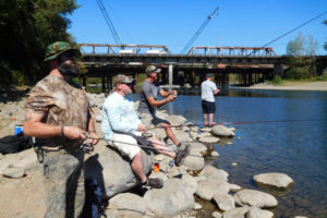 Kevin McCallum, Toby Nunn, John Kaiser and Eddie Cecil (left to right) recently fished off the banks of the Washougal River. They and other active duty members and veterans of the 23rd Infantry (the Tomahawks) participated in several events in the Camas-Washougal and Vancouver area Sept. 8-11. Trip expenses were paid for by Veteran Outdoors, a national 501(c) 3 non-profit organization, and donations from area businesses and residents. 