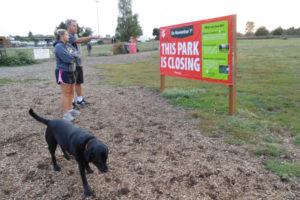 Jeanine and Aaron Tyger enjoyed walking around the Donald and Angeline Stevenson Off Leash Area with their black lab, Kyra, Monday night. The Tygers, of Vancouver, have visited the dog park in Washougal, for more than eight years. The park will close Oct. 31, and the land is available for sale or lease.