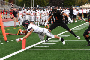 Michael Matthews dives across the goal line to score his first of four touchdowns for the Camas football team Friday, at Davis High School in Yakima. The Papermakers won 64-6. (Photo courtesy of Kris Cavin)