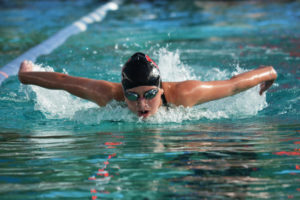 Abby Crowson soars to first place in the 100-meter butterfly Sept. 28, at LaCamas Swim & Sport. She also helped Camas win the 200 medley and 200 freestyle relay races against Union, Mountain View and Heritage. 